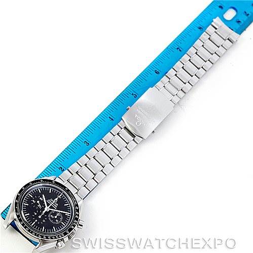 The image shows an Omega Speedmaster 3570.50.00 Men
s Stainless Steel Black Dial 3570.50.00 Men
s Stainless Steel Black Dial watch laid flat, displaying the face and entire bracelet alongside a ruler for size reference.