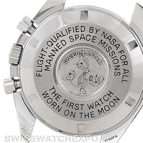 The image shows the back of an Omega Speedmaster 3570.50.00 Men
s Stainless Steel Black Dial 3570.50.00 Men
s Stainless Steel Black Dial watch, highlighting the engraved text and emblem commemorating its NASA flight qualification.