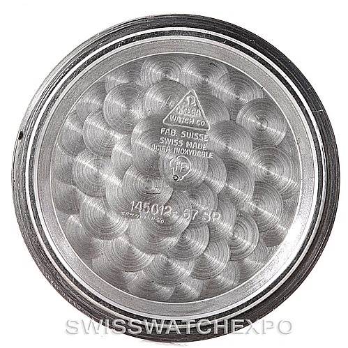 This image shows the inner case back of an Omega Speedmaster Men
s Stainless Steel Black Dial Men
s Stainless Steel Black Dial watch, with model and brand engravings visible.