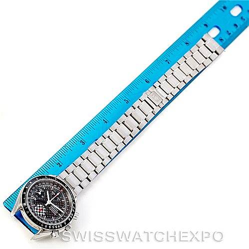This image shows an Omega Speedmaster 3529.50.00 Men
s Stainless Steel Black Dial 3529.50.00 Men
s Stainless Steel Black Dial watch laid flat next to a blue ruler, displaying its face and metal bracelet.
