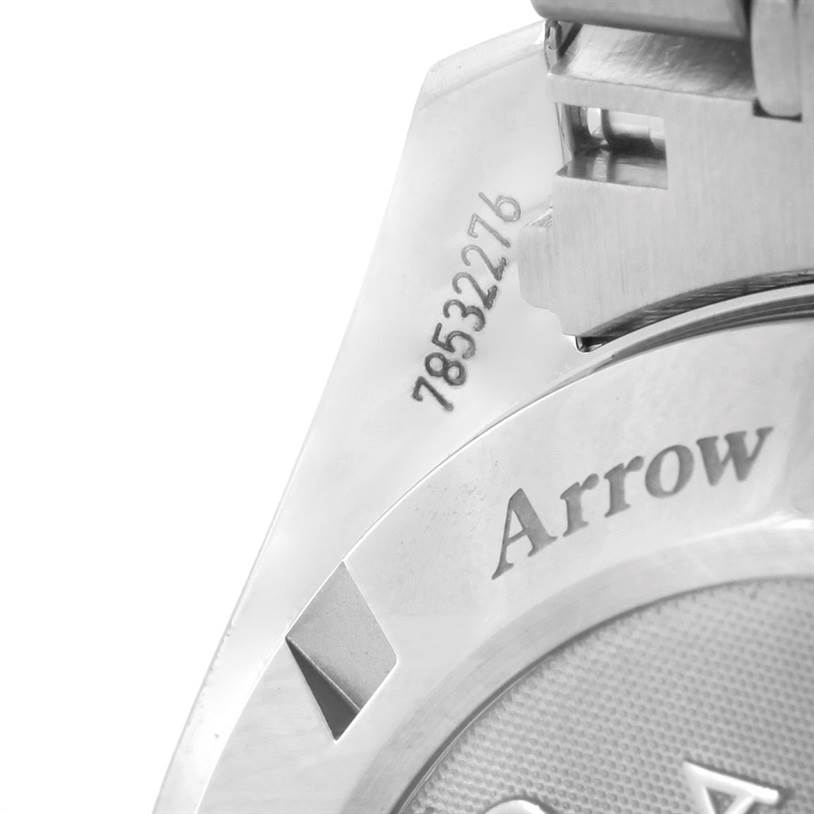 The image shows a close-up of the clasp and part of the case back of an Omega Speedmaster 321.10.42.50.04.001 Men
s Stainless Steel White Dial 321.10.42.50.04.001 Men
s Stainless Steel White Dial watch, featuring some engraved text and numbers.