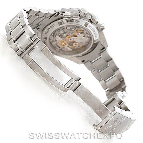 The image shows the Omega Speedmaster 3572.50.00 Men
s Stainless Steel Black Dial 3572.50.00 Men
s Stainless Steel Black Dial watch from a rear angle, highlighting the bracelet and the transparent case back revealing the movement.