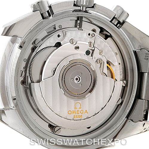 The image shows a close-up of the Omega Speedmaster 3510.50.00 Men
s Stainless Steel Black Dial 3510.50.00 Men
s Stainless Steel Black Dial
s movement and inner mechanism from the back.