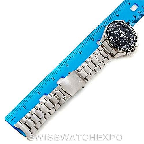 The image shows an Omega Speedmaster 3572.50.00 Men's Stainless Steel Black Dial 3572.50.00 Men's Stainless Steel Black Dial watch from a top-down angle, alongside a blue ruler for scale.