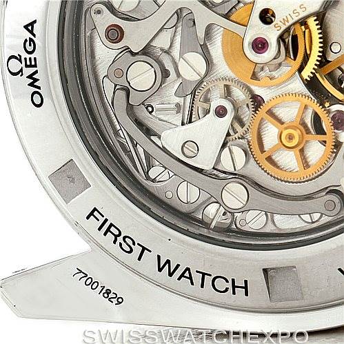 The image shows a close-up of the Omega Speedmaster 3572.50.00 Men
s Stainless Steel Black Dial 3572.50.00 Men
s Stainless Steel Black Dial watch
s transparent case back, revealing its intricate mechanical movement.