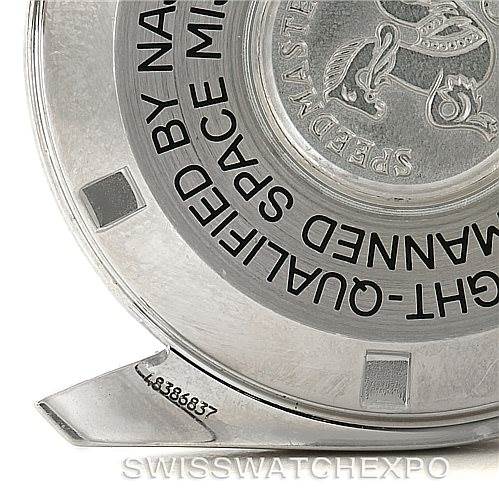 The image shows the back case of an Omega Speedmaster Men
s Stainless Steel Black Dial Men
s Stainless Steel Black Dial watch, highlighting its engravings and serial number.