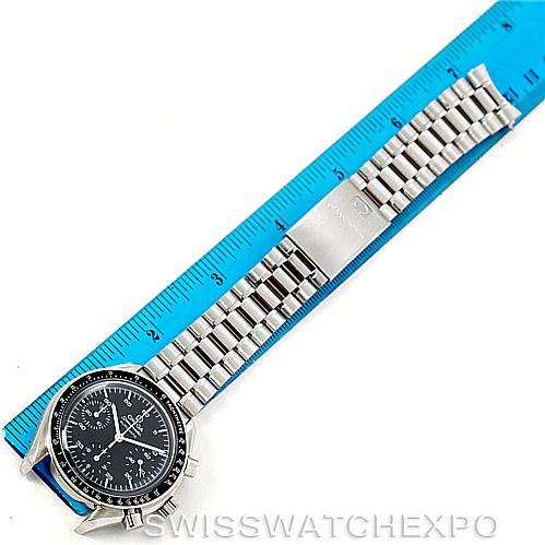 The image shows an Omega Speedmaster 3510.50.00 Men
s Stainless Steel Black Dial 3510.50.00 Men
s Stainless Steel Black Dial watch laid flat on a blue ruler, displaying the watch face, bezel, and metal bracelet.