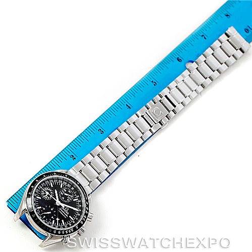 The image shows an Omega Speedmaster 3520.50.00 Men
s Stainless Steel Black Dial 3520.50.00 Men
s Stainless Steel Black Dial watch placed flat with its bracelet next to a blue ruler.