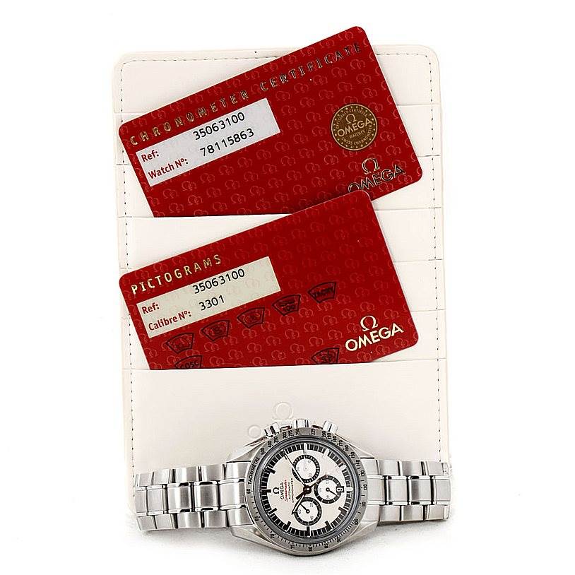 The image shows an Omega Speedmaster 3506.31.00 Men
s Stainless Steel Silver Dial 3506.31.00 Men
s Stainless Steel Silver Dial watch laid flat below its Chronometer Certification and Pictograms cards.