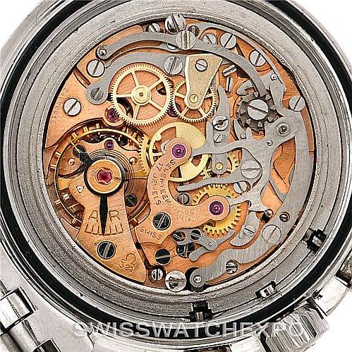 This image shows the intricate inner mechanics of an Omega Speedmaster Men
s Stainless Steel Black Dial Men
s Stainless Steel Black Dial watch, viewed from the back with a focus on the gears and movement.