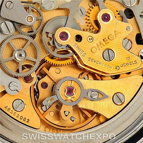 This image shows a close-up view of the intricate inner workings of an Omega Speedmaster Men
s Stainless Steel Black Dial Men
s Stainless Steel Black Dial watch movement.