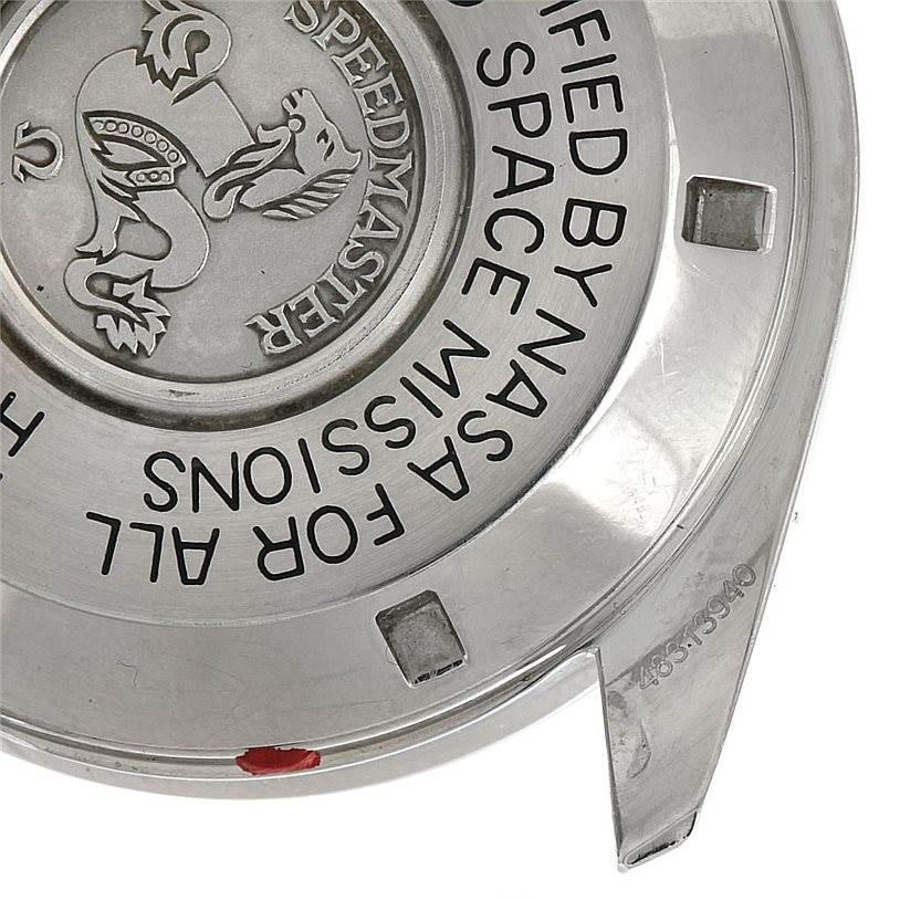 This image shows the engraved case back of an Omega Speedmaster Men
s Stainless Steel Black Dial Men
s Stainless Steel Black Dial watch, highlighting part of its inscription and design.