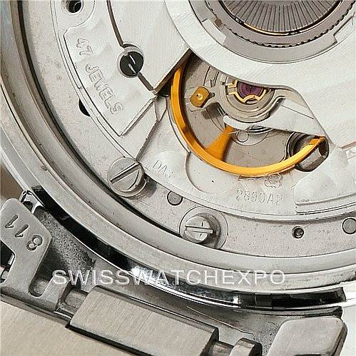 This close-up image shows the back view of the Omega Speedmaster 3510.50.00 Men
s Stainless Steel Black Dial 3510.50.00 Men
s Stainless Steel Black Dial
s movement mechanism and part of its bracelet.