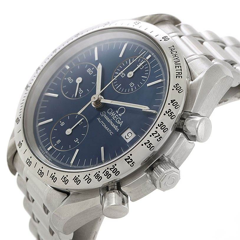 The image shows an angled side view of an Omega Speedmaster 3513.80.00 Men
s Stainless Steel Blue Dial 3513.80.00 Men
s Stainless Steel Blue Dial watch highlighting its dial, bezel, crown, and chronograph pushers.