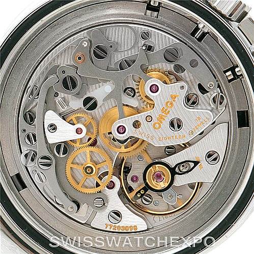 The image shows the rear view of an Omega Speedmaster 3570.50.00 Men
s Stainless Steel Black Dial 3570.50.00 Men
s Stainless Steel Black Dial watch, highlighting its intricate movement and internal mechanisms.