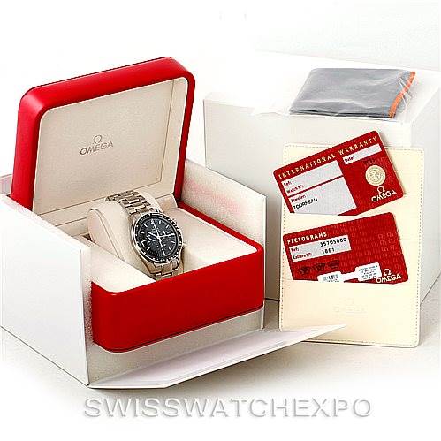 The image shows the Omega Speedmaster 3570.50.00 Men
s Stainless Steel Black Dial 3570.50.00 Men
s Stainless Steel Black Dial watch at an angled view in its box, along with warranty cards and documentation.