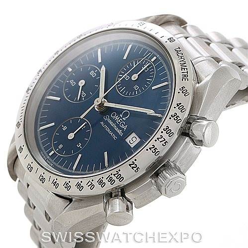 The image shows a side angle of an Omega Speedmaster 3513.80.00 Men
s Stainless Steel Blue Dial 3513.80.00 Men
s Stainless Steel Blue Dial, highlighting its dial, tachymeter bezel, and stainless steel band.