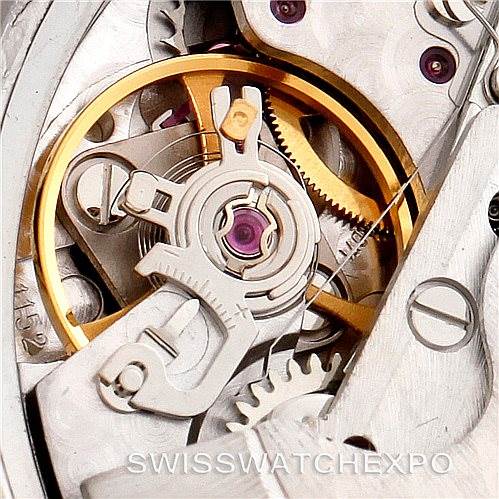 This close-up image shows the intricate inner workings of the Omega Speedmaster 3513.80.00 Men
s Stainless Steel Blue Dial 3513.80.00 Men
s Stainless Steel Blue Dial model watch, highlighting its gears and mechanisms.