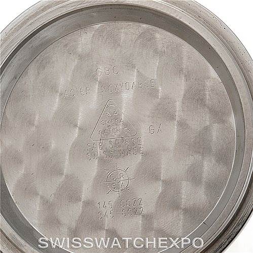 This image shows the inside case back of an Omega Speedmaster 3570.50.00 Men
s Stainless Steel Black Dial 3570.50.00 Men
s Stainless Steel Black Dial watch, displaying engravings such as model numbers and branding details.