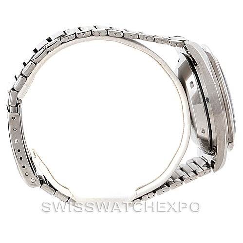 The image shows a side profile view of an Omega Speedmaster Men
s Stainless Steel Black Dial Men
s Stainless Steel Black Dial watch, highlighting its metal bracelet and case.