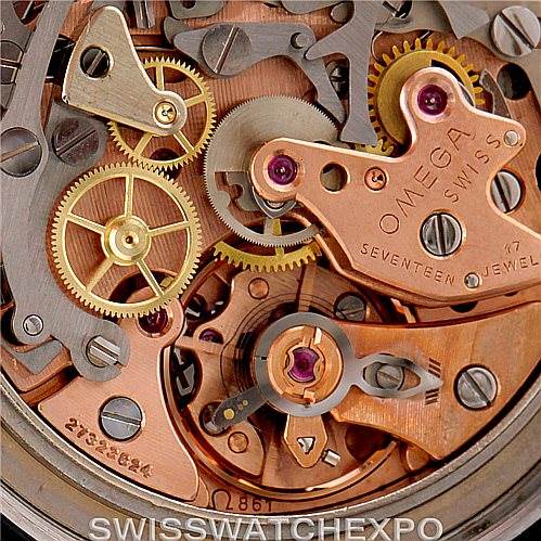 This image shows the inner mechanical components of an Omega Speedmaster Men
s Stainless Steel Black Dial Men
s Stainless Steel Black Dial watch, focusing on its movement and gears.