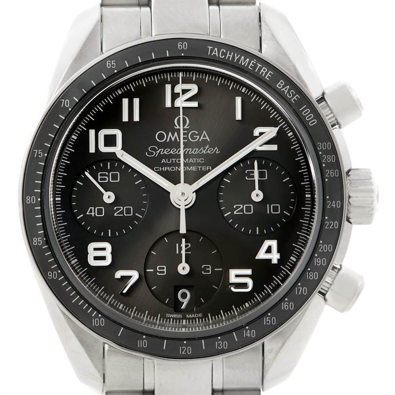 The image shows a front view of an Omega Speedmaster watch, highlighting the face, subdials, tachymeter, and crown.