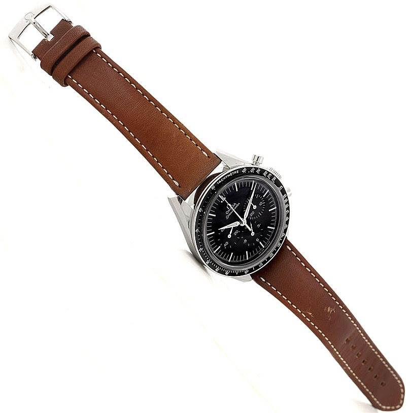 The Omega Speedmaster 311.32.40.30.01.001 Men
s Stainless Steel Black Dial 311.32.40.30.01.001 Men
s Stainless Steel Black Dial watch is shown at an oblique angle, displaying the face, bezel, crown, and brown leather strap.