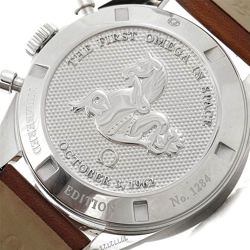 The image shows the engraved case back of the Omega Speedmaster 311.32.40.30.01.001 Men
s Stainless Steel Black Dial 311.32.40.30.01.001 Men
s Stainless Steel Black Dial model, highlighting text and commemorative design elements.