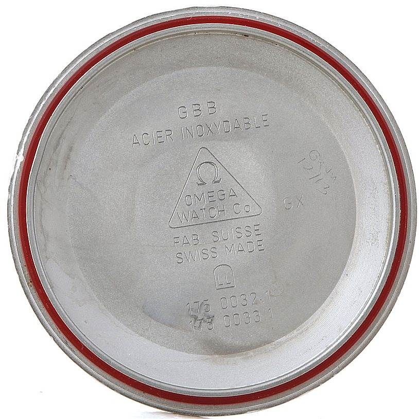 The image shows the interior of the case back for an Omega Speedmaster 3510.50.00 Men
s Stainless Steel Black Dial 3510.50.00 Men
s Stainless Steel Black Dial model, with inscriptions and a red gasket ring.