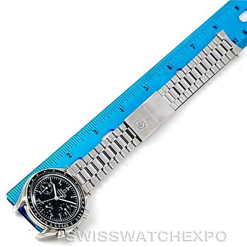 The image shows an Omega Speedmaster 3510.50.00 Men
s Stainless Steel Black Dial 3510.50.00 Men
s Stainless Steel Black Dial watch laid flat next to a ruler, displaying the face and metal bracelet.