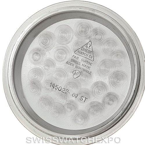 The image shows the inside of the case back of an Omega Speedmaster Men
s Stainless Steel Black Dial Men
s Stainless Steel Black Dial watch with model details engraved.