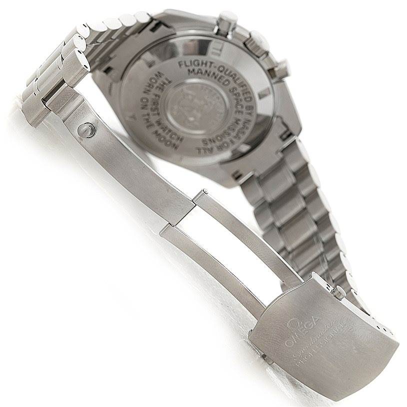 This image shows the back case and open clasp of an Omega Speedmaster Men
s Stainless Steel Black Dial Men
s Stainless Steel Black Dial watch, with visible engravings.