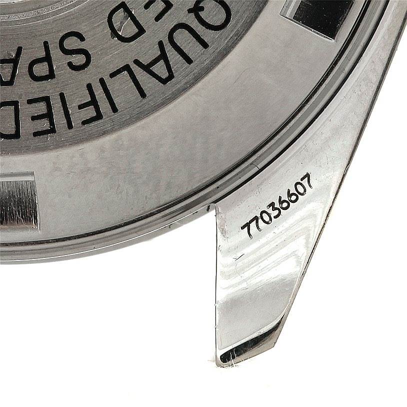 The image shows the back case of the Omega Speedmaster Men
s Stainless Steel Black Dial Men
s Stainless Steel Black Dial watch, focusing on the serial number and engraved text.