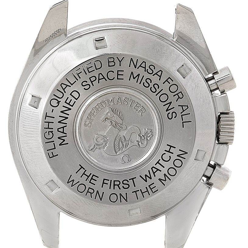 The image shows the back case of an Omega Speedmaster 48365704 Men
s Stainless Steel Black Dial 48365704 Men
s Stainless Steel Black Dial watch with NASA and moon landing engravings.