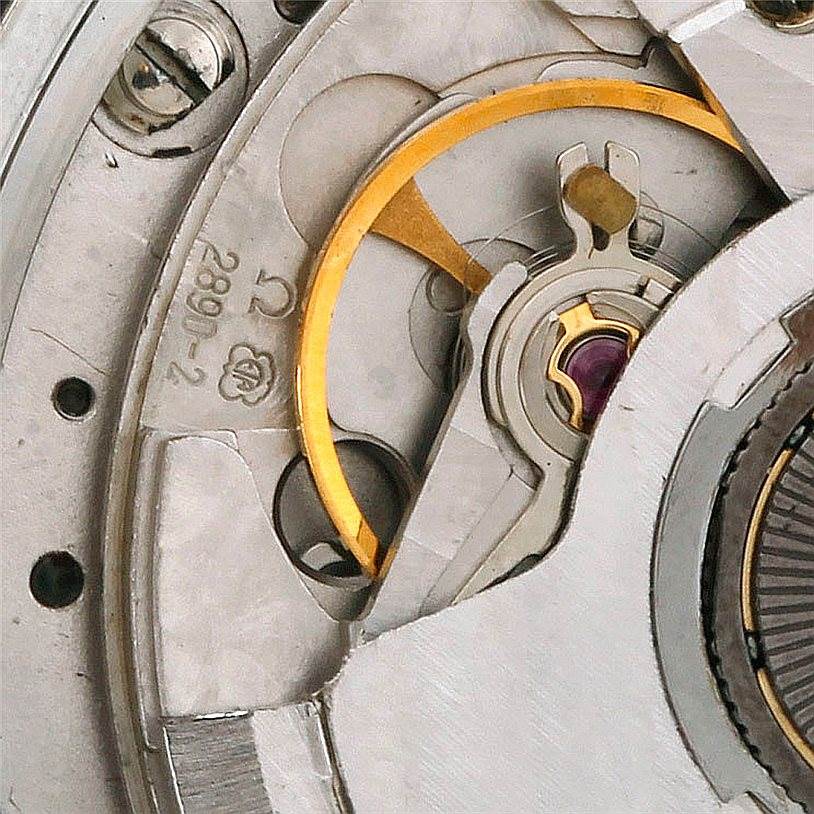 Close-up view of the Omega Speedmaster 3510.50.00 Men
s Stainless Steel Black Dial 3510.50.00 Men
s Stainless Steel Black Dial
s internal watch movement, highlighting gears and finely crafted components.