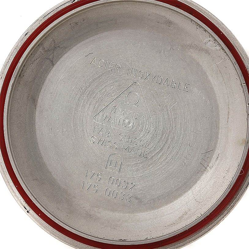 The image shows the inside of the case back of an Omega Speedmaster 3510.50.00 Men
s Stainless Steel Black Dial 3510.50.00 Men
s Stainless Steel Black Dial watch, featuring various inscriptions and markings.