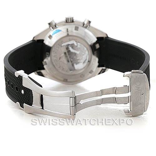 This image shows the backside of an Omega Speedmaster 326.32.40.50.11.001 Men's Stainless Steel Red Dial 326.32.40.50.11.001 Men's Stainless Steel Red Dial model with an open locking clasp and black rubber strap.