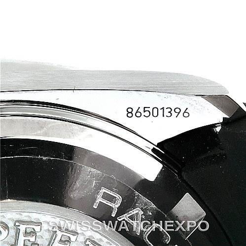 This image shows a close-up of the Omega Speedmaster 326.32.40.50.11.001 Men's Stainless Steel Red Dial 326.32.40.50.11.001 Men's Stainless Steel Red Dial's case back and part of the bracelet with the serial number 86501396 visible.