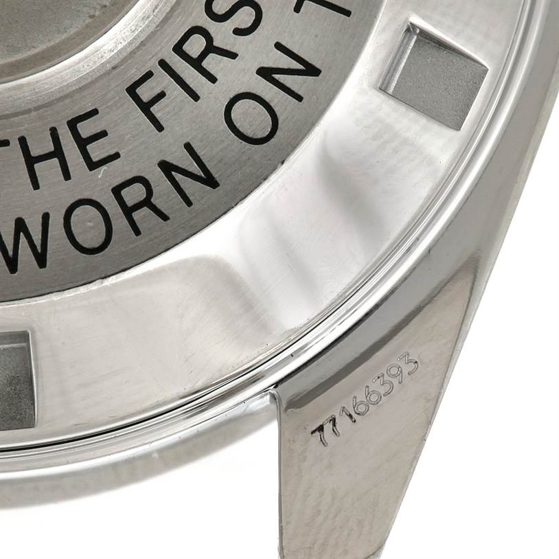 This close-up image shows the engraved back and partial polished case of the Omega Speedmaster Men
s Stainless Steel Black Dial Men
s Stainless Steel Black Dial watch.