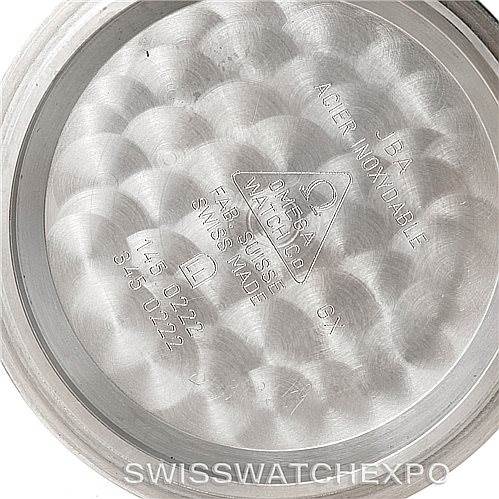 This image shows the inner case back of an Omega Speedmaster 3594.50.00 Men
s Stainless Steel Black Dial 3594.50.00 Men
s Stainless Steel Black Dial watch, highlighting its inscriptions and brushed metal texture.