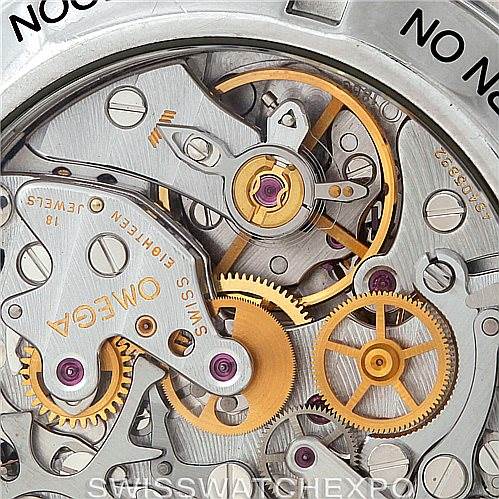 This close-up image shows the intricate internal mechanism of an Omega Speedmaster 3572.50.00 Men
s Stainless Steel Black Dial 3572.50.00 Men
s Stainless Steel Black Dial watch, revealing gears and components.