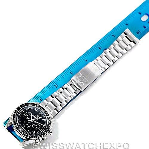 The image shows an Omega Speedmaster 3572.50.00 Men
s Stainless Steel Black Dial 3572.50.00 Men
s Stainless Steel Black Dial watch placed next to a ruler, displaying its entire length and stainless steel bracelet.