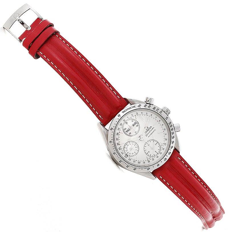 The Omega Speedmaster 3521.30.00 Men
s Stainless Steel White Dial 3521.30.00 Men
s Stainless Steel White Dial watch is shown at an angled view, showcasing the red leather strap, case, and dials.