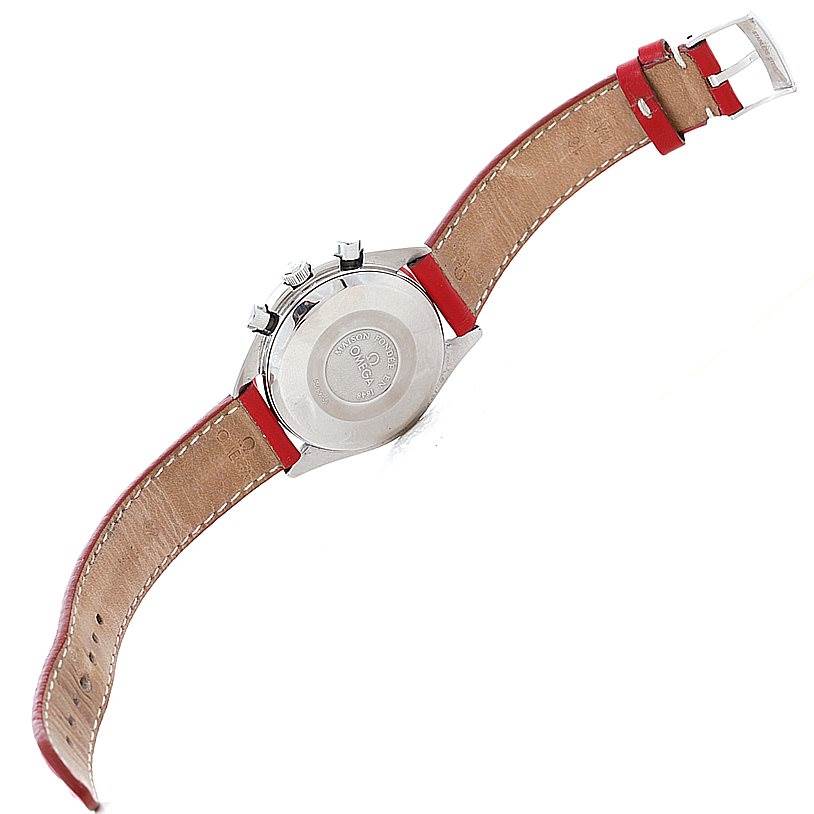 The image shows the back view of an Omega Speedmaster 3521.30.00 Men
s Stainless Steel White Dial 3521.30.00 Men
s Stainless Steel White Dial watch with a red leather strap and buckle.