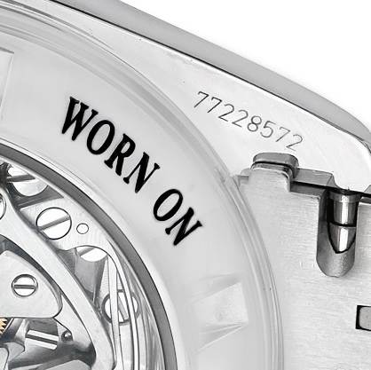 This image shows a close-up of the case back and part of the movement of an Omega Speedmaster 3573.50.00 Men
s Stainless Steel Black Dial 3573.50.00 Men
s Stainless Steel Black Dial watch.