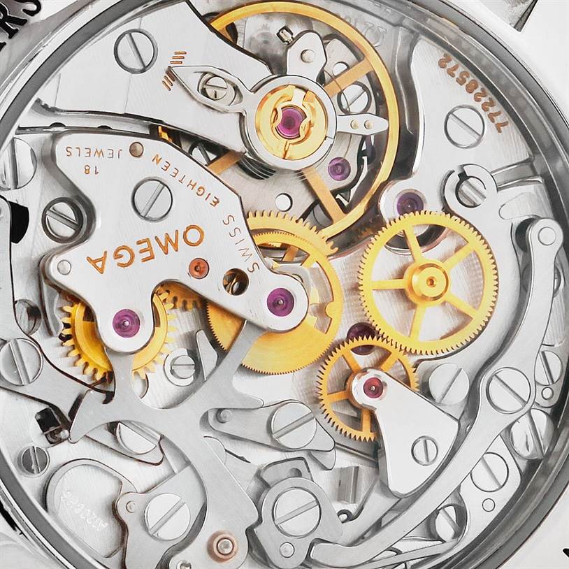 The image shows a close-up view of the Omega Speedmaster 3573.50.00 Men
s Stainless Steel Black Dial 3573.50.00 Men
s Stainless Steel Black Dial
s exposed movement, highlighting gears and mechanical components.