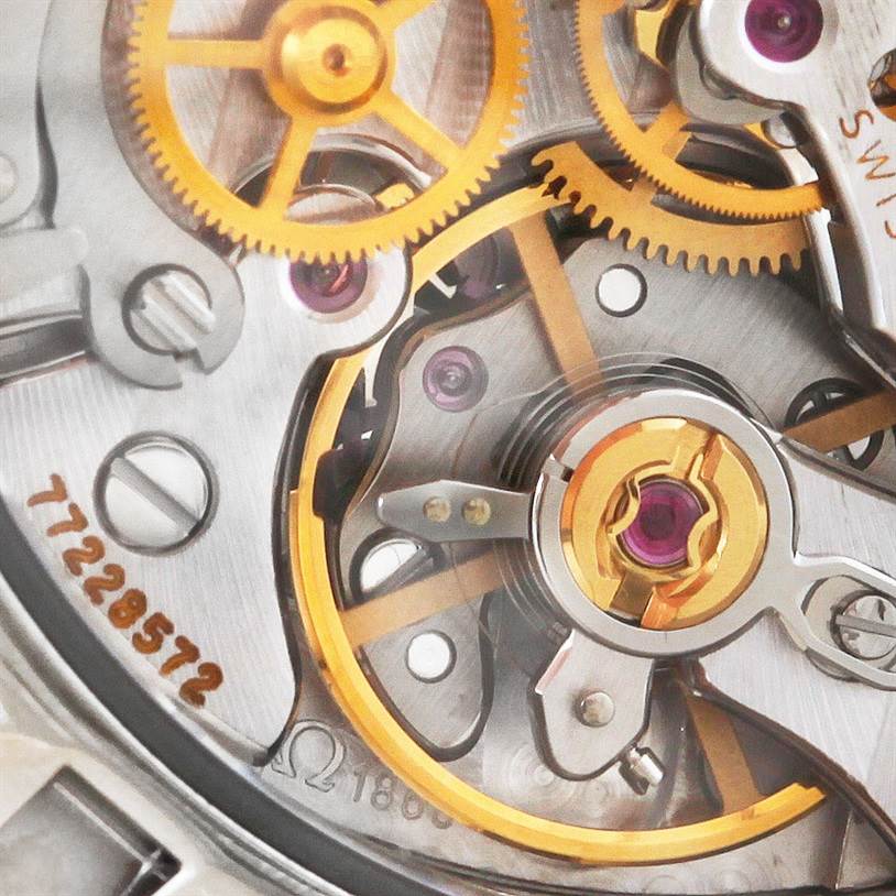 This image shows a close-up view of the mechanical movement and gears of an Omega Speedmaster 3573.50.00 Men
s Stainless Steel Black Dial 3573.50.00 Men
s Stainless Steel Black Dial watch.