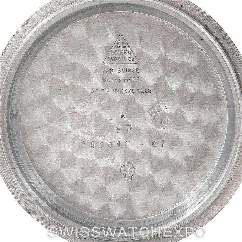 This image shows the interior case back of an Omega Speedmaster Men
s Stainless Steel Black Dial Men
s Stainless Steel Black Dial watch, featuring model details and manufacturing markings.