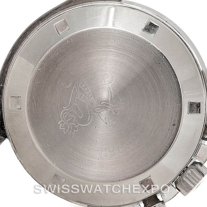 The image shows the case back of an Omega Speedmaster Men
s Stainless Steel Black Dial Men
s Stainless Steel Black Dial watch viewed from the back.