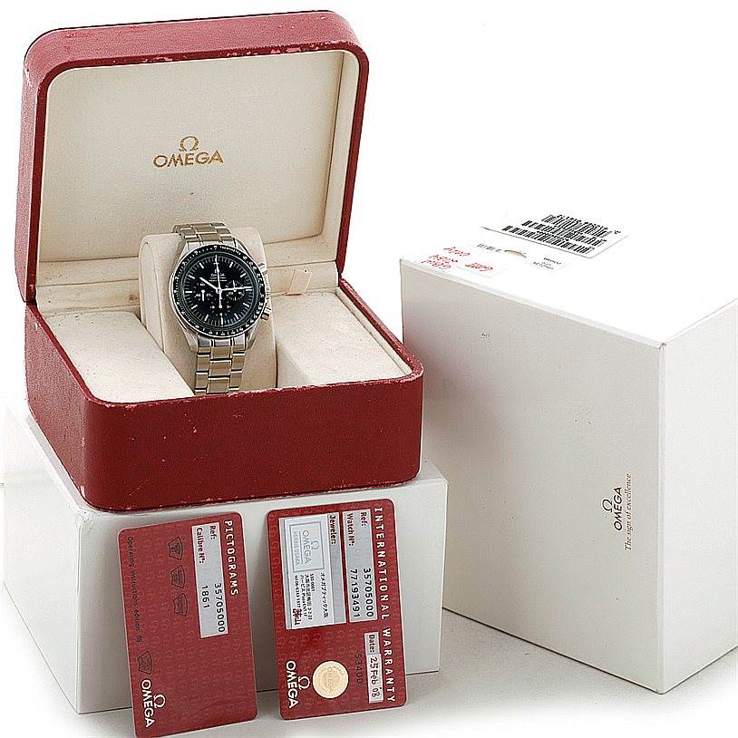 The Omega Speedmaster 3570.50.00 Men
s Stainless Steel Black Dial 3570.50.00 Men
s Stainless Steel Black Dial watch is displayed at an angle, showing its face and bracelet in an open box with warranty and pictogram cards nearby.